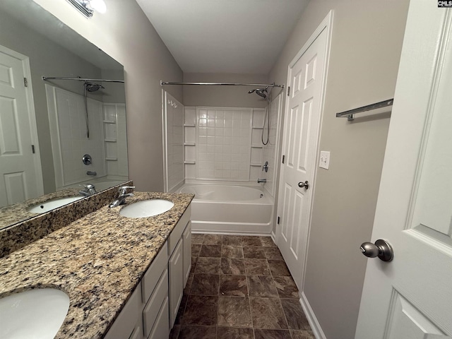 bathroom with vanity and tiled shower / bath combo