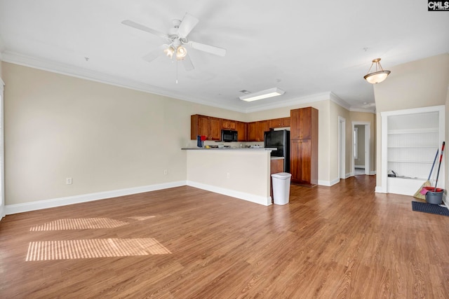 unfurnished living room featuring light hardwood / wood-style flooring, ceiling fan, and ornamental molding