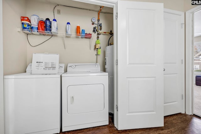 washroom featuring washer and dryer and dark wood-type flooring