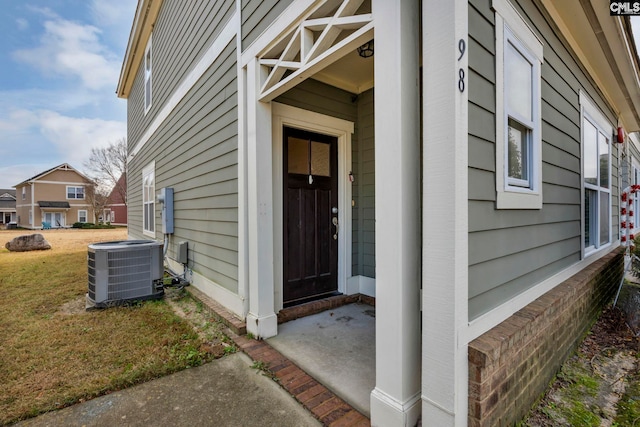 doorway to property featuring cooling unit