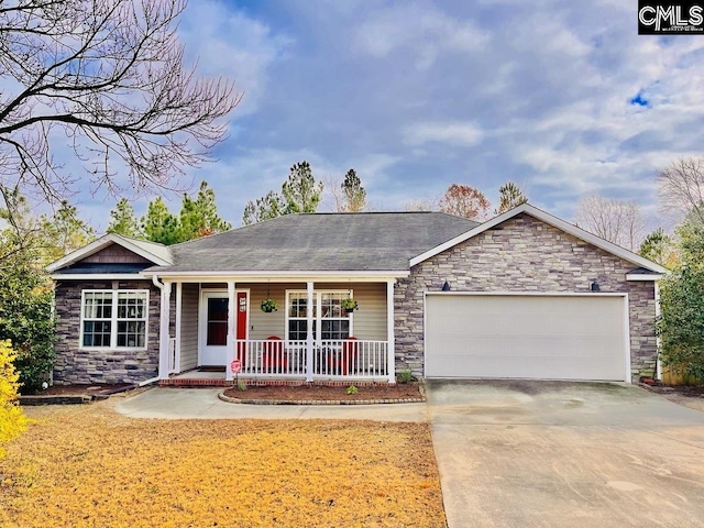 single story home featuring a porch and a garage