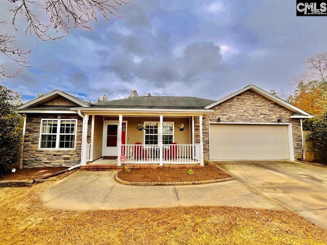 ranch-style house featuring a porch and a garage