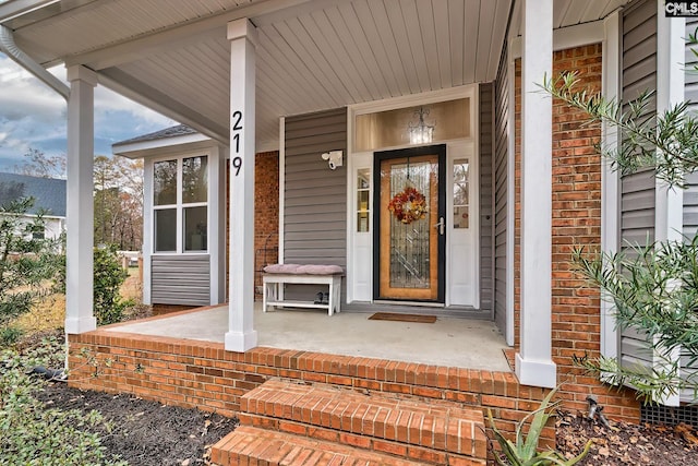 doorway to property featuring a porch