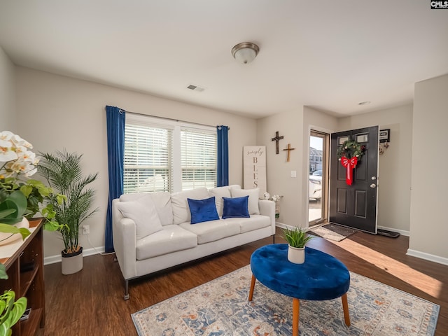 living room with dark hardwood / wood-style floors