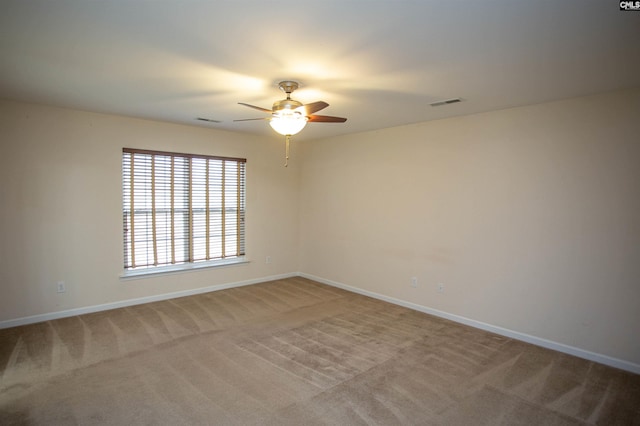 unfurnished room with carpet flooring and ceiling fan