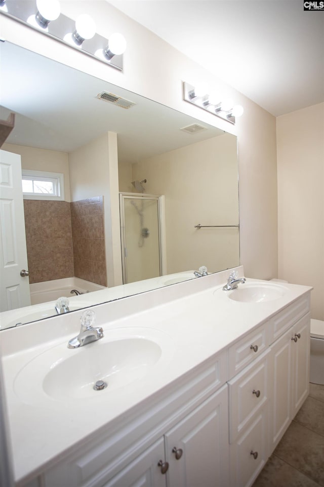 bathroom featuring separate shower and tub, tile patterned flooring, and vanity