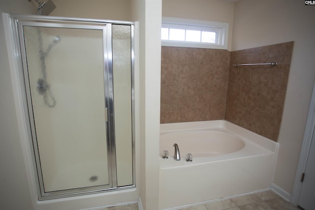 bathroom featuring tile patterned floors and separate shower and tub