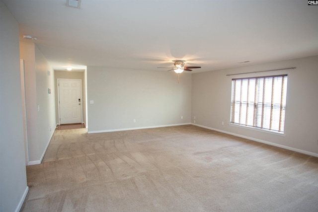 unfurnished room featuring ceiling fan and light colored carpet