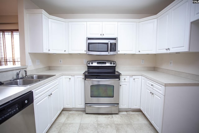 kitchen featuring sink, white cabinetry, and stainless steel appliances