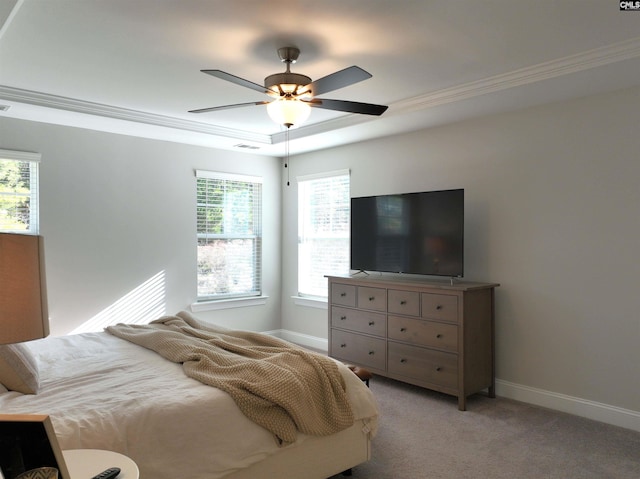 bedroom with ceiling fan, light colored carpet, visible vents, baseboards, and ornamental molding