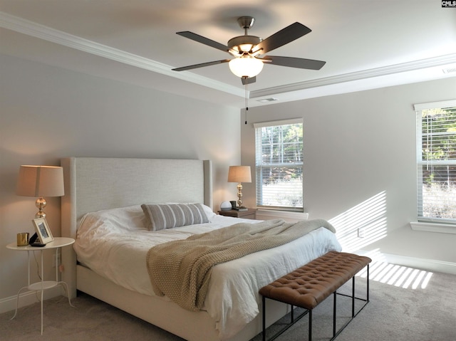 carpeted bedroom with multiple windows, ornamental molding, and ceiling fan