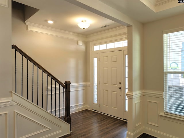 entrance foyer featuring dark hardwood / wood-style floors and ornamental molding