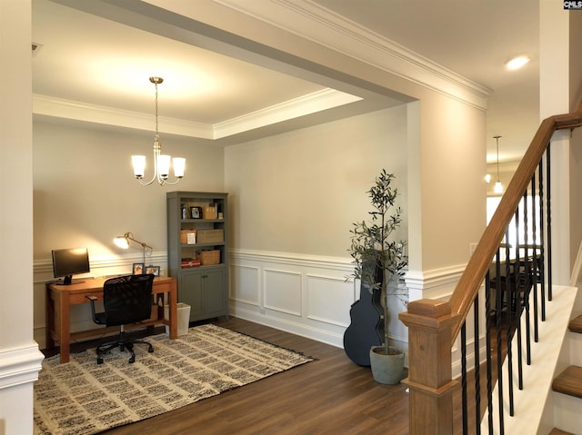 office space featuring a wainscoted wall, dark wood finished floors, a decorative wall, ornamental molding, and a chandelier