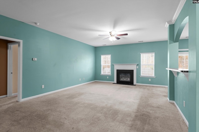 unfurnished living room featuring ceiling fan and light carpet