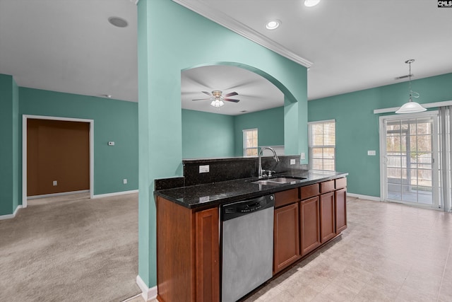 kitchen featuring ceiling fan, dishwasher, sink, hanging light fixtures, and light carpet