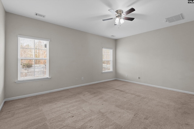 carpeted empty room with ceiling fan