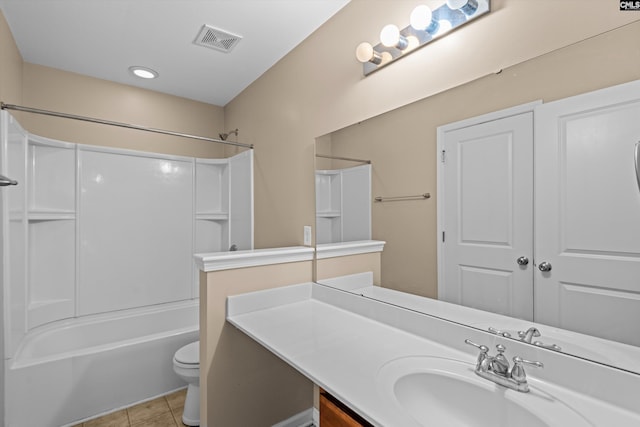 full bathroom featuring toilet, vanity, tile patterned floors, and washtub / shower combination