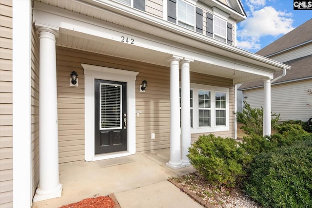 doorway to property featuring a porch