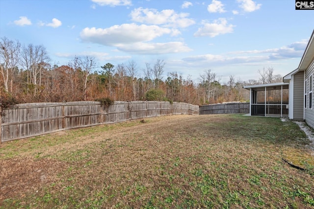 view of yard with a sunroom