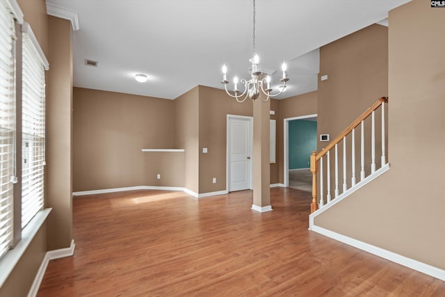 interior space with light wood-type flooring and a notable chandelier