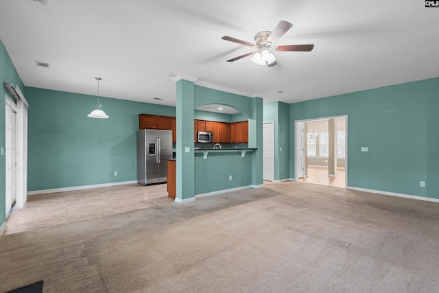 unfurnished living room featuring ceiling fan and light carpet