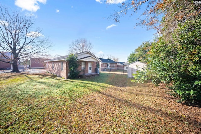 view of yard with a storage shed