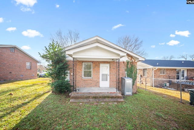 rear view of house with a lawn