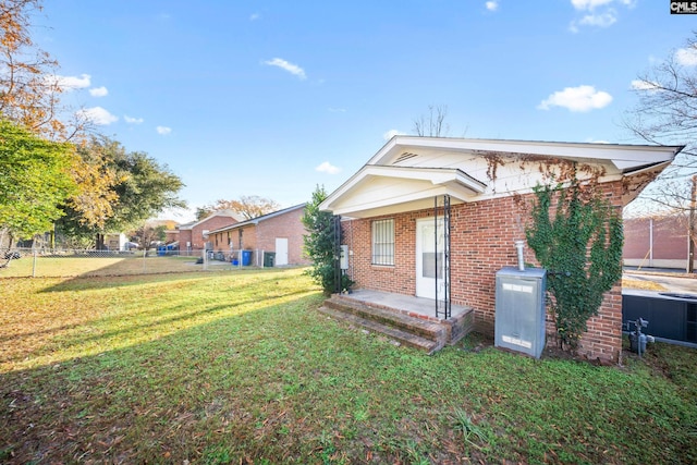 view of property exterior with a yard