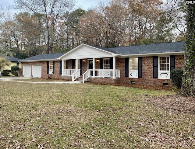 view of front facade featuring covered porch, a garage, and a front lawn