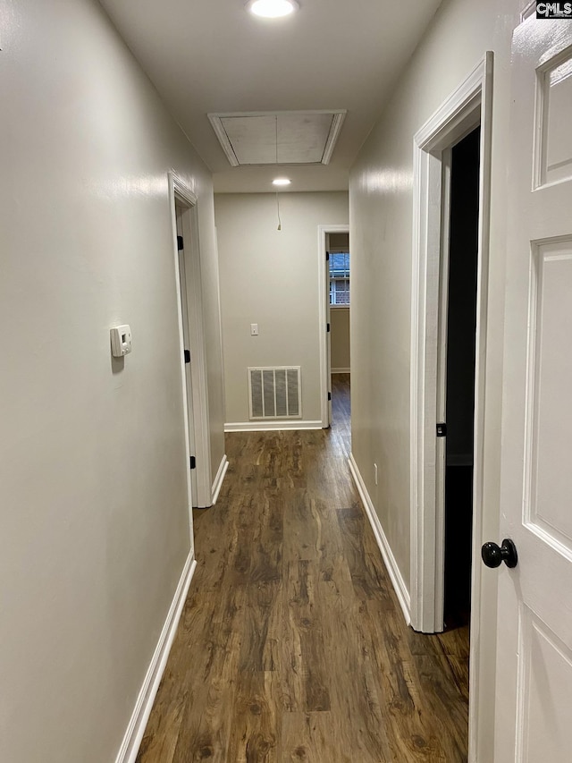 hallway featuring dark wood-type flooring