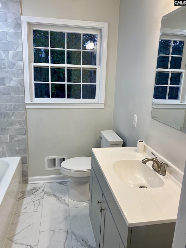 bathroom with vanity and toilet