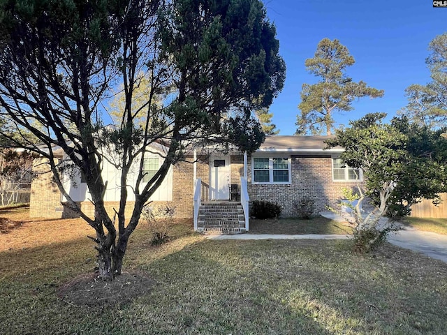 view of front of home with a front yard