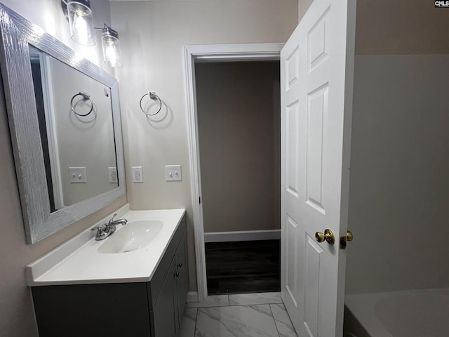 bathroom with a bath and vanity