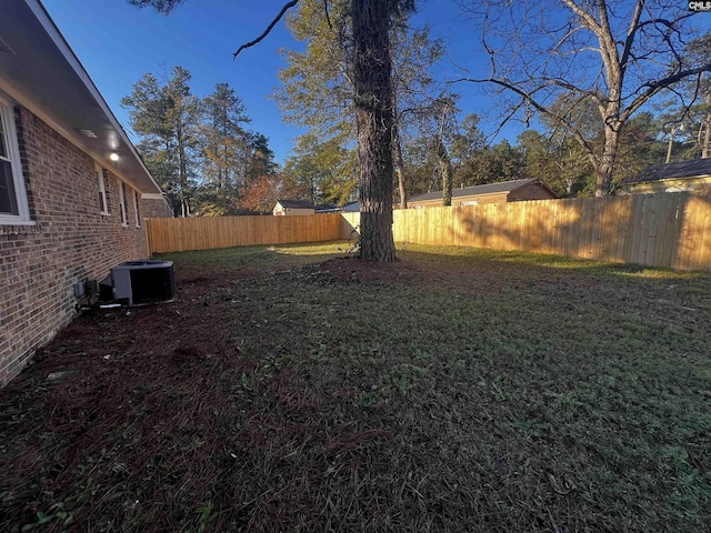 view of yard featuring central air condition unit