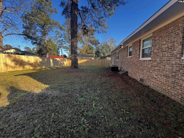 view of yard featuring central AC