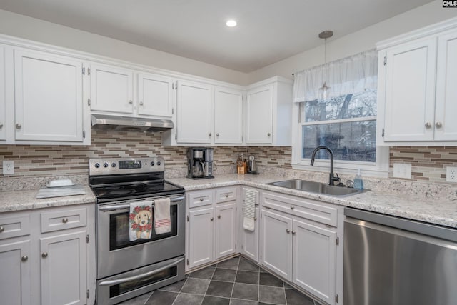 kitchen featuring white cabinetry, sink, stainless steel appliances, pendant lighting, and exhaust hood