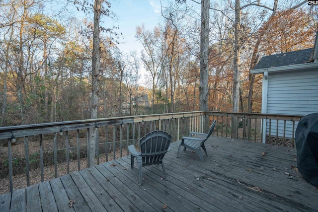 wooden deck with grilling area