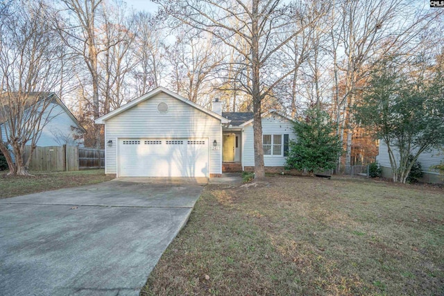 ranch-style house featuring a garage and a front yard