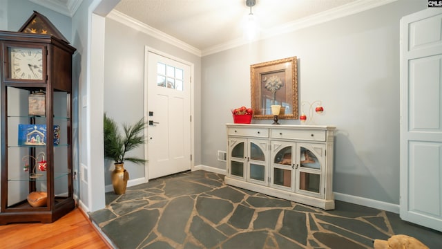 foyer entrance featuring crown molding and dark hardwood / wood-style flooring