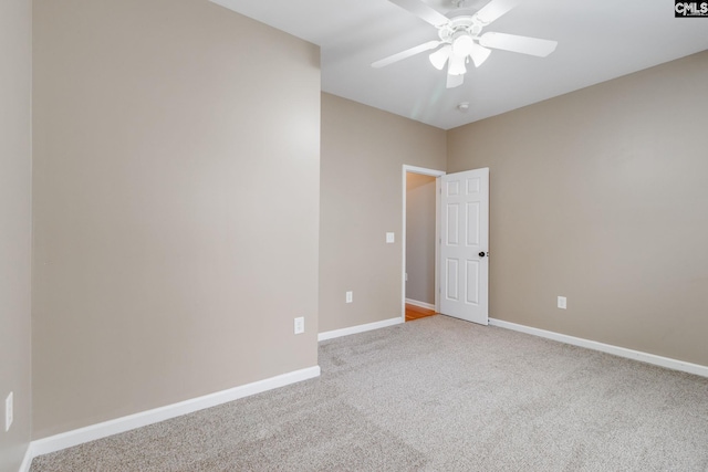 spare room with carpet flooring and ceiling fan