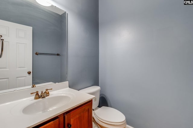 bathroom with vanity and toilet