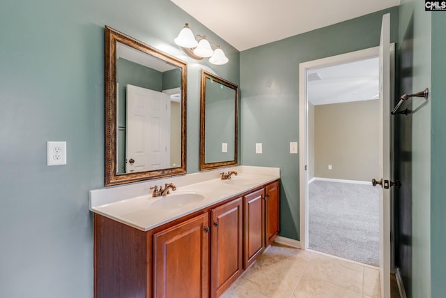 bathroom with tile patterned flooring and vanity