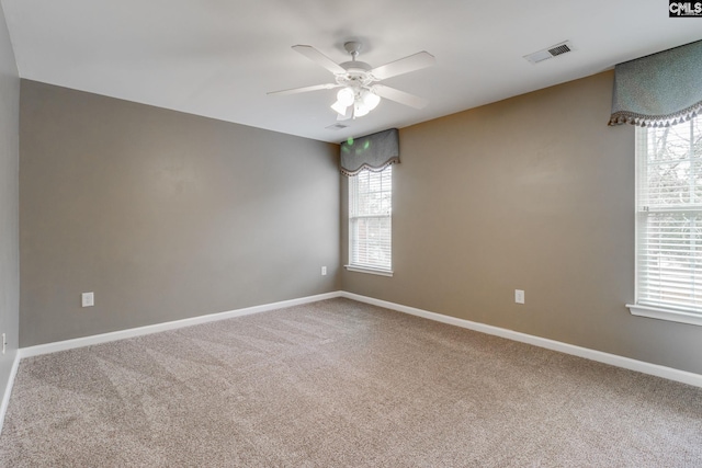 empty room with carpet and ceiling fan