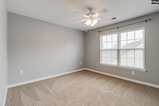 spare room with carpet flooring and ceiling fan