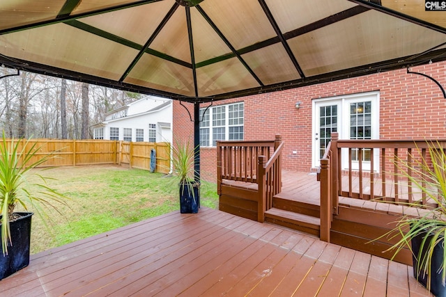 deck featuring a gazebo and a yard