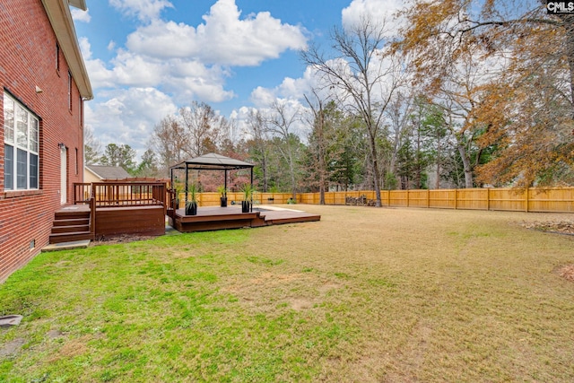 view of yard featuring a gazebo and a deck