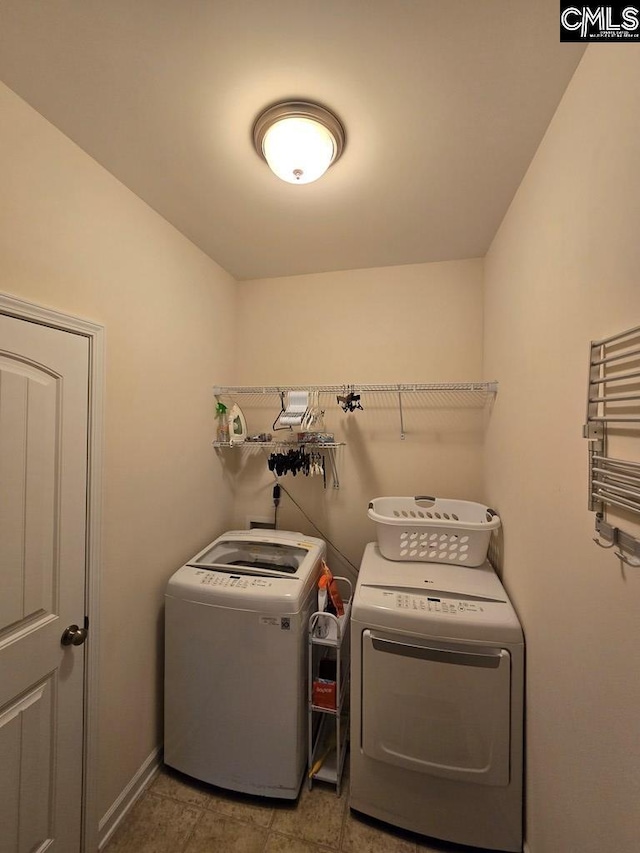 laundry area with separate washer and dryer