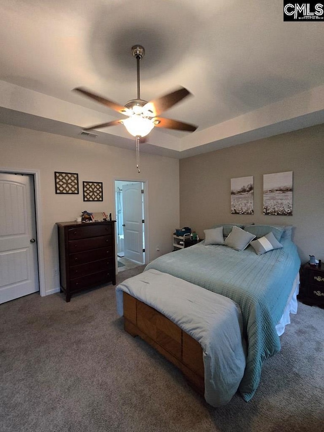 carpeted bedroom with ceiling fan