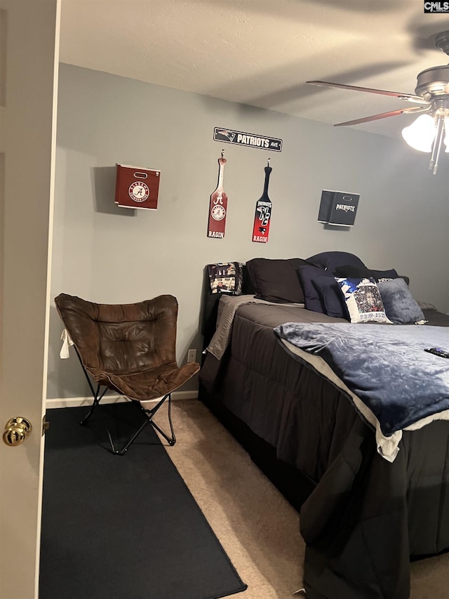 bedroom featuring light carpet and ceiling fan