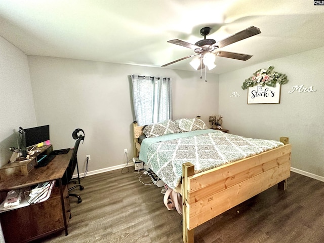 bedroom featuring dark hardwood / wood-style flooring and ceiling fan